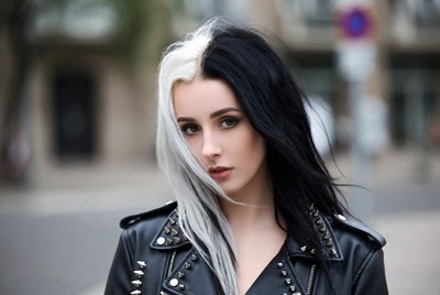 Young woman with black and white hair