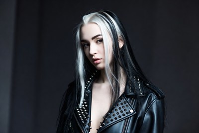 Young woman with black and white hair