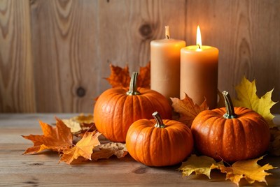Pumpkins and candles on a table