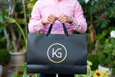 Holding a shopping bag outdoors