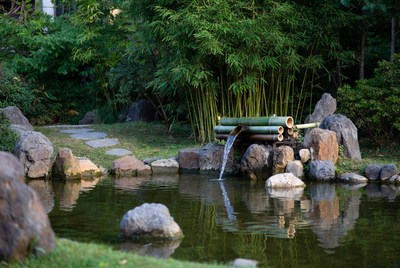 Bamboo fountain in garden setting