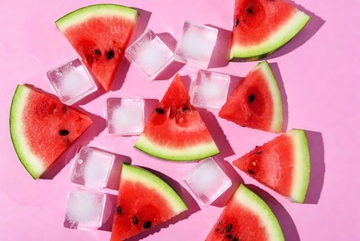 Watermelon and ice on pink surface