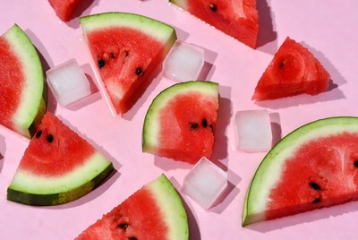Watermelon pieces on pink surface
