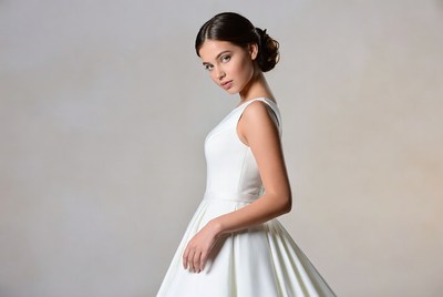 Woman wearing white dress in studio