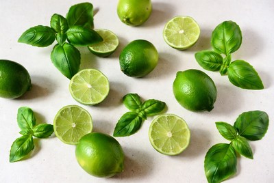 Fresh limes and basil on the table