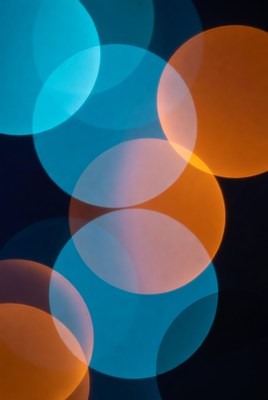 Colorful circles blend in dark space