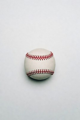 Baseball resting on plain surface
