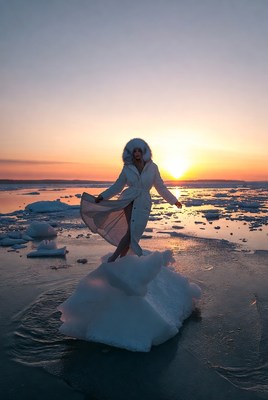 Woman on ice at sunset