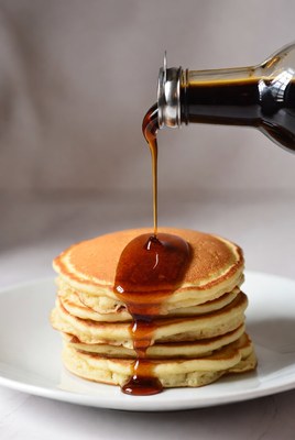 Pancakes with syrup at breakfast time