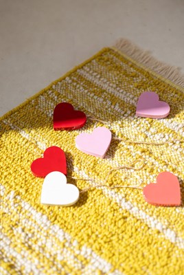 Hearts on a yellow rug