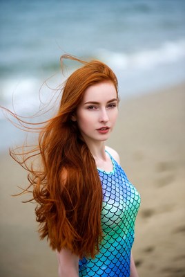 Model at beach with ocean background