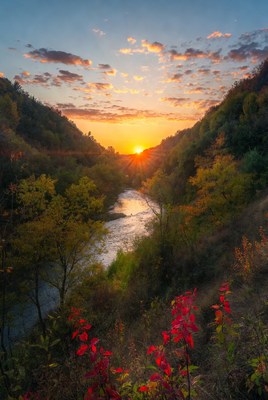 Sunset over river in autumn valley