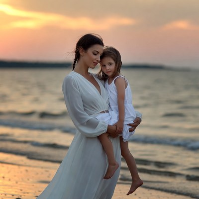 Mother and daughter at sunset