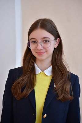 Young woman stands for portrait