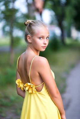 Girl in yellow dress outdoors