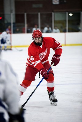 Youth hockey player on ice rink