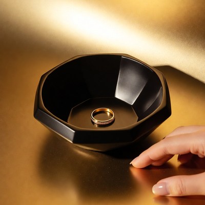 Ring resting in black bowl