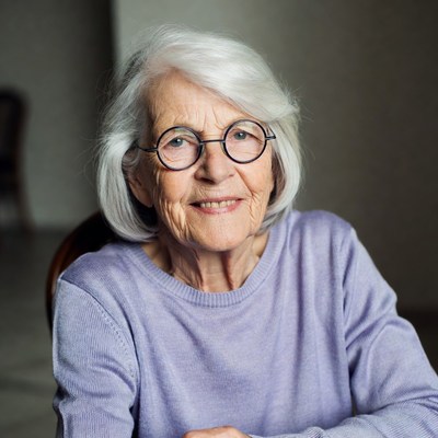 Elderly woman smiling in home