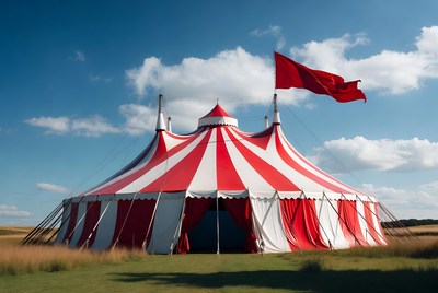 Large circus tent with red flag