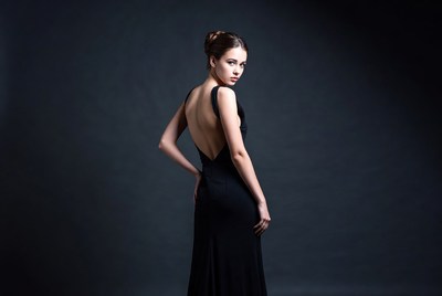 Model poses in black dress