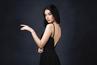 Woman posing in black dress