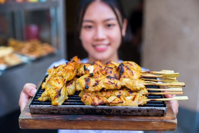 Grilled meat skewers in market