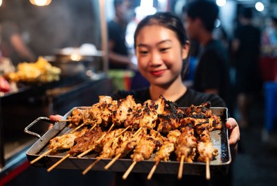 Cooking and serving grilled food at night market