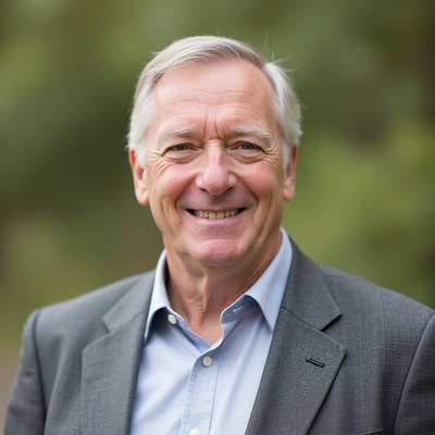 Smiling man in gray suit outdoors