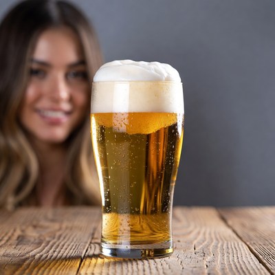 Woman enjoys beer at bar