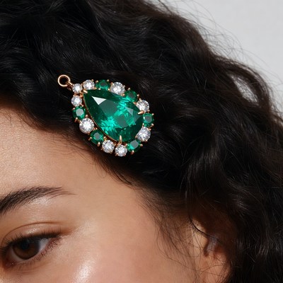 Emerald hair clip on dark curly hair
