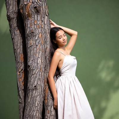 Woman by tree in natural setting