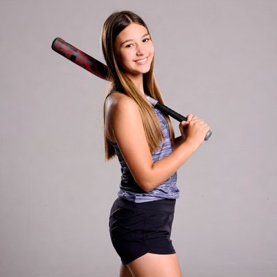 Young athlete posing with bat