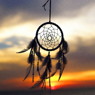 Dream catcher at sunset sky