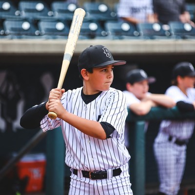 Young player prepares for baseball game