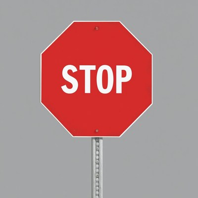 Stop sign against gray background