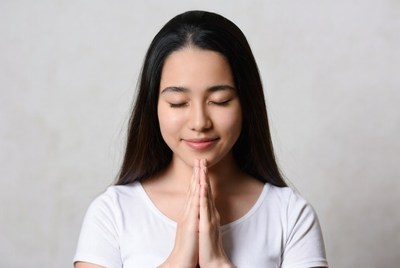 Young woman practices mindfulness indoors