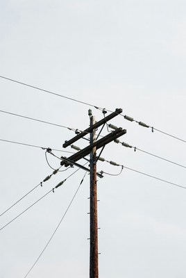 Utility pole with wires in the sky
