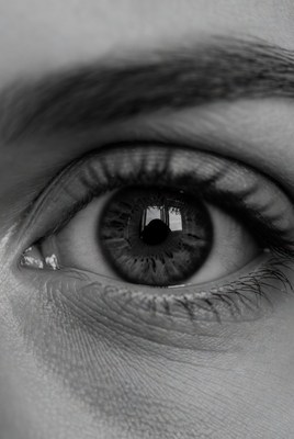 Close up of a person's eye reflecting a view