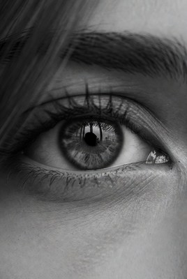 Close-up eye reflecting surroundings