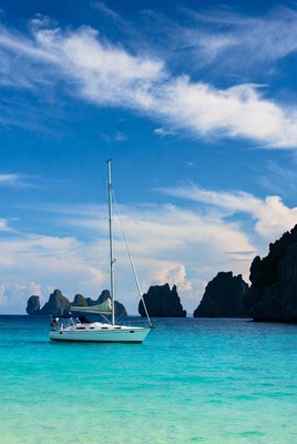 Sailboat in clear blue water