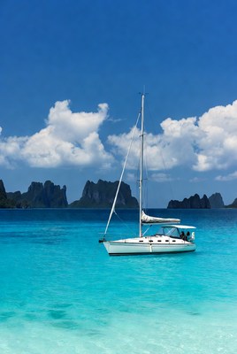 Sailboat in clear blue waters