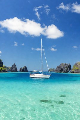 Sailboat in clear blue water