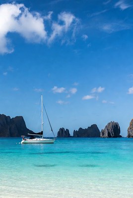 Sailboat on clear blue water