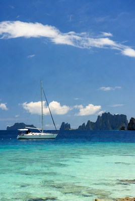 Sailboat on clear blue water