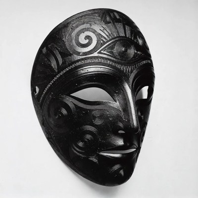 Black carved mask from a culture