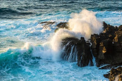 Waves crashing against rocky shore