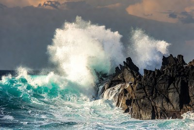 Waves crashing on rocky coastline