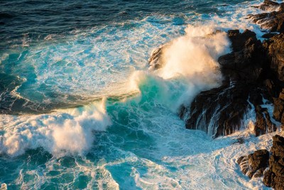 Waves crashing on rocky shore