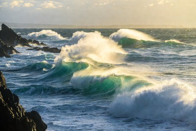 Waves crashing on rocky shore