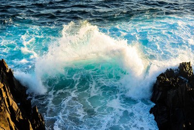 Waves crash on rocky shore